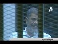 مرسي يضحك وراء القفص